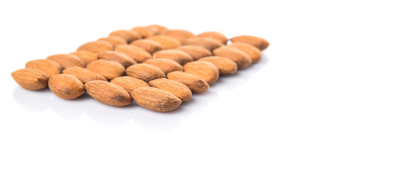 Raw almond nut over white background