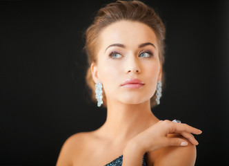 woman with diamond earrings