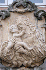 Virgin Mary with baby Jesus, house facade in Graz, Austria