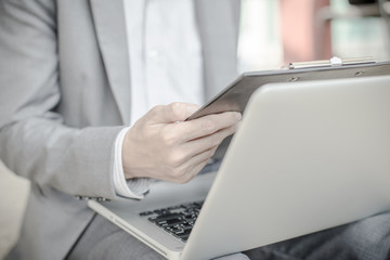 Young successful young man holding a report. Accounting