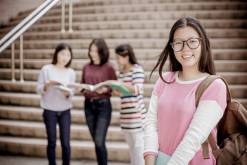 Fototapeta na wymiar group of happy teen high school students outdoors