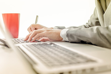 Businessman analyzing investment charts with laptop. Accounting