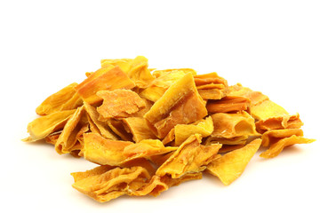colorful pieces of dried mango fruit on a white background