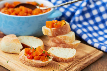 Pumpkin caviar on a slice of baguette