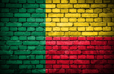 Brick wall with painted flag of Benin