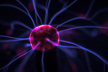 Obraz premium hand and plasma ball flames on a black background