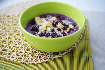 Blueberry porridge with banana cranberries and sesame