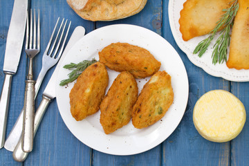 fish croquettes on white plate