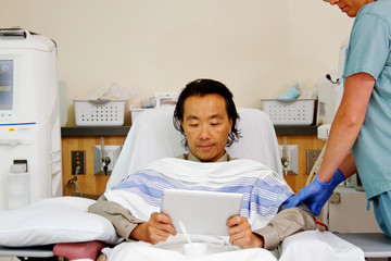 Asian patient receiving dialysis
