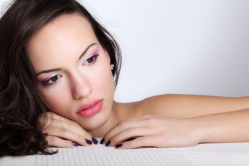 Obraz premium Portrait of young beautiful woman with fashion makeup