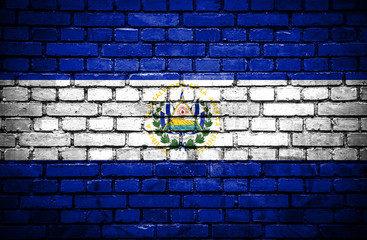 Brick wall with painted flag of El Salvador