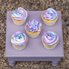 pink Cup-cakes on a wooden tray