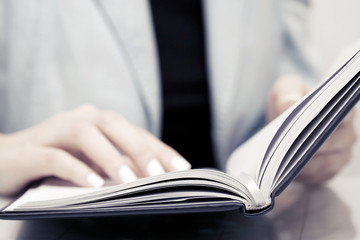 Business woman reading a book