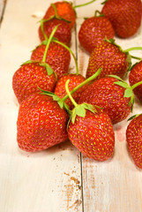 ripe and sweet strawberries on wooden table