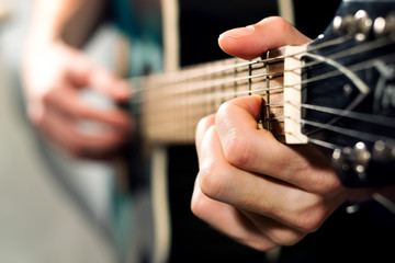 Man playing on the acoustic guitar