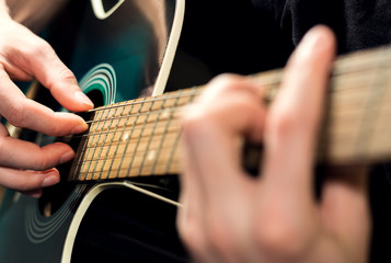 man playing on the guitar