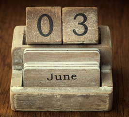 A very old wooden vintage calendar showing the date 3rd June on