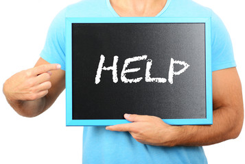 Man holding blackboard in hands and pointing the word HELP