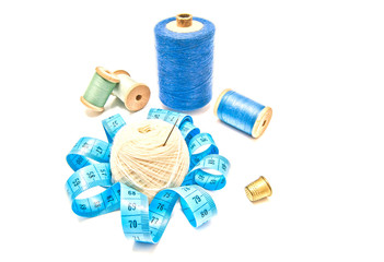 different spools of thread and meter