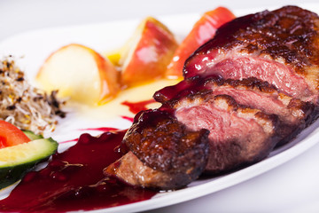 Delicious baked meat in pomegranate.