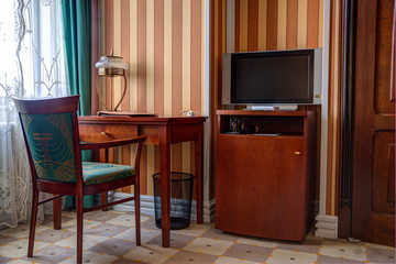 Study room with writing desk and lcd tv set