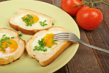 Fried eggs in a plate on the table