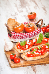 Italian starter, bruschetta with Sicilian red fresh tomato and m