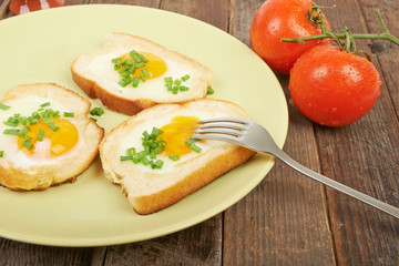 Fried eggs in a plate on the table