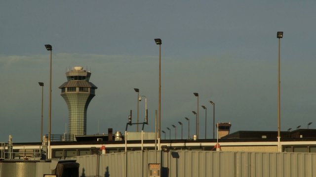 Airport - taxiway, runway, airport terminals and airplanes