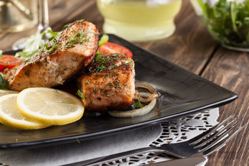 Fried salmon steak with vegetables