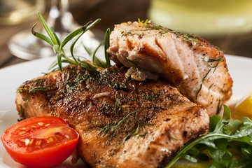 Fried salmon steak with vegetables