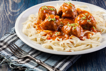 Pasta fettuccine and meatballs with tomato sauce