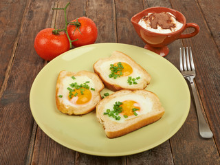 Fried eggs in a plate on the table