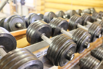 Fototapeta premium Dumbells in a rack at the gym