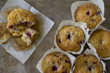 Raspberry Muffins from Above with one Eaten