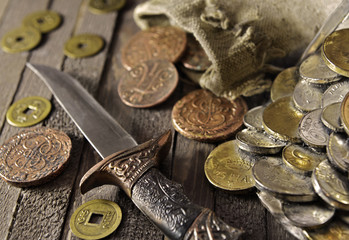 Decorated dagger with ancient coins