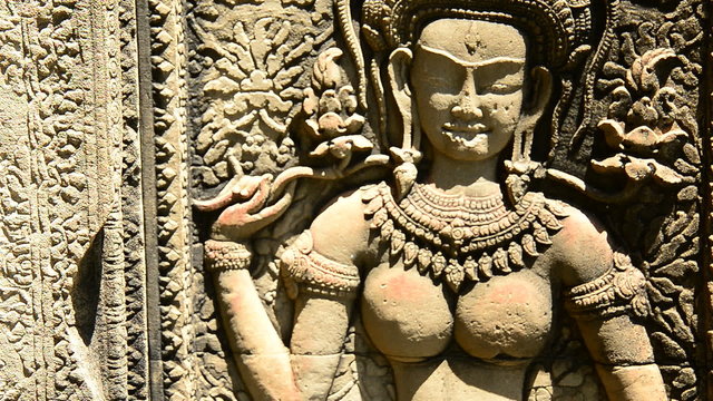 Stone Carving of Buddha Goddess on Temple Wall - Angkor Wat Cambodia