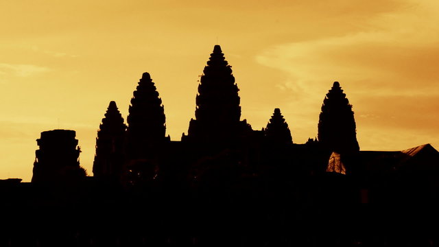 Zoom out of Silhouettes of Main Temple Spires at Sunrise - Angkor Wat, Cambodia