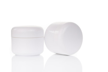 close up of beauty cream container on white background