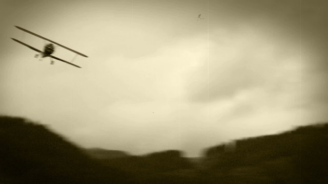 Old film effect: WWII Biplane in the air