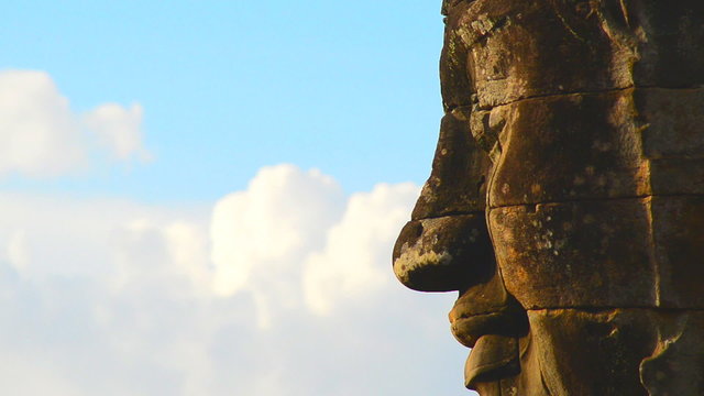 Zoom Out of Stone Carving of Buddha's Face on Temple Wall - Angkor Wat Temple Cambodia