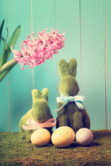 Easter bunnies with eggs and hyacinth flower