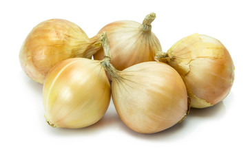 Gold onions isolated on white background.