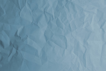 Crumpled pale blue paper texture for background