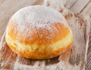 Donut with powdered sugar.