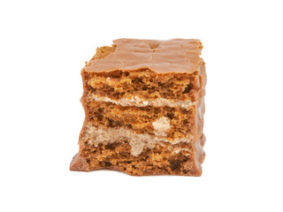 The broken pieces of chocolate biscuit isolated on white