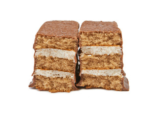 The broken pieces of chocolate biscuit isolated on white