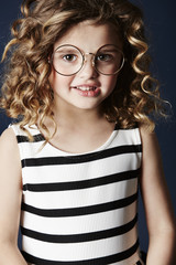 Young girl in glasses and dress