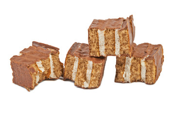 The broken pieces of chocolate biscuit isolated on white