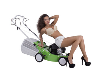 Sexy woman with lawn mower